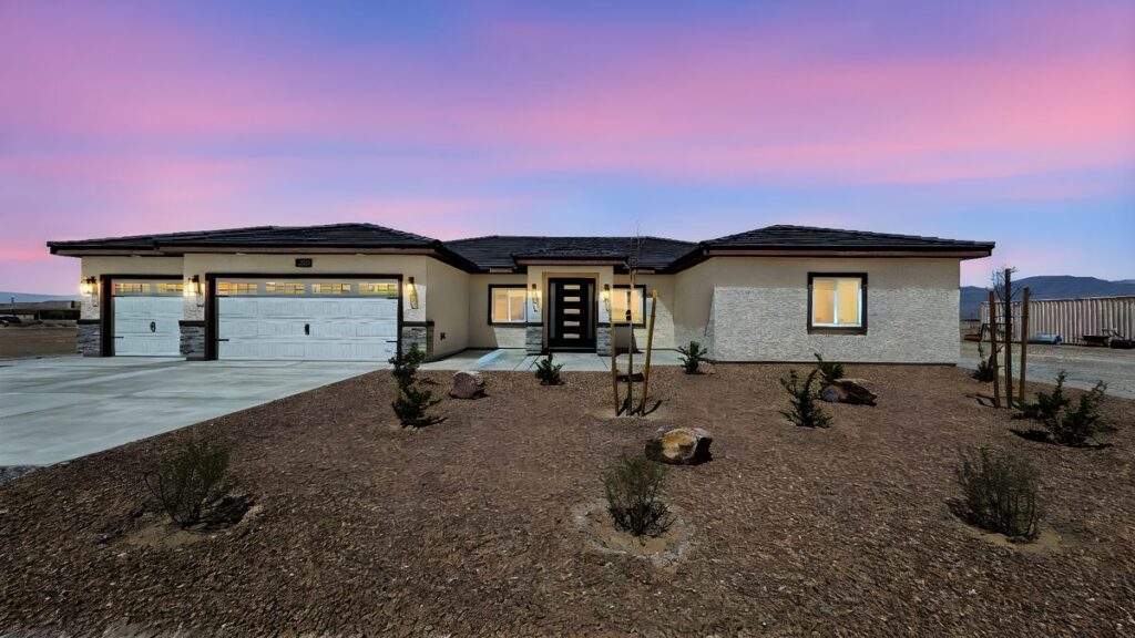 New construction custom home exterior at dusk in Pahrump, Nevada built by Innovative Custom Homes